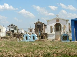 Typical Paraguayan cemetery. They build small cities in honoring their dead. Tombstones range from a simple cross (for the poorest of poor buried in the ground) to small buildings above ground for those with more means.
