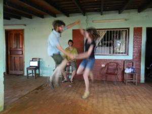 Peace Corps volunteer friends celebrating the end of training Dec 2012 with a dance party on the front porch of my host family. This photo captures the essence of the day quite nicely.