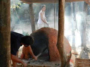 This cave-like oven, called a tatakua ('tata' is 'fire' and 'kua' is 'hole' in guarani), is used to cooked Paraguayan breads like chipa and sopa. A hot fire is made and left to burn until the oven is very hot, then the coals are removed and the breads baked with the residual heat.