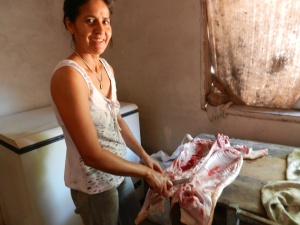 Isabel cutting up a pig for an asado (BBQ) to celebrate my arrival in the community.
