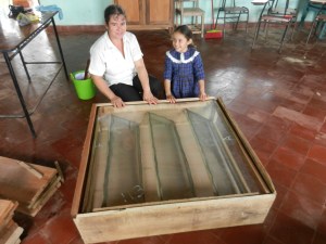 A local senora is mighty proud of her newly-finished solar food dryer built with help from her 7-year old daughter. This will allow them to use the sun to dry fruits, veggies, and meat to save for leaner months.