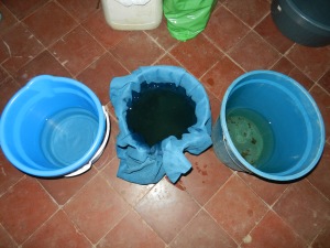 My filtration system from the dirty well. (Right) untreated well water, (Center) filtering through a chamois towel, (Left) boiled and chlorinated.
